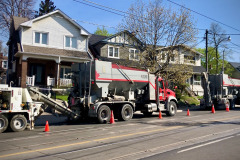 Readymix concrete trucks lined up on Gerrard Street East. Toronto, Ontario.