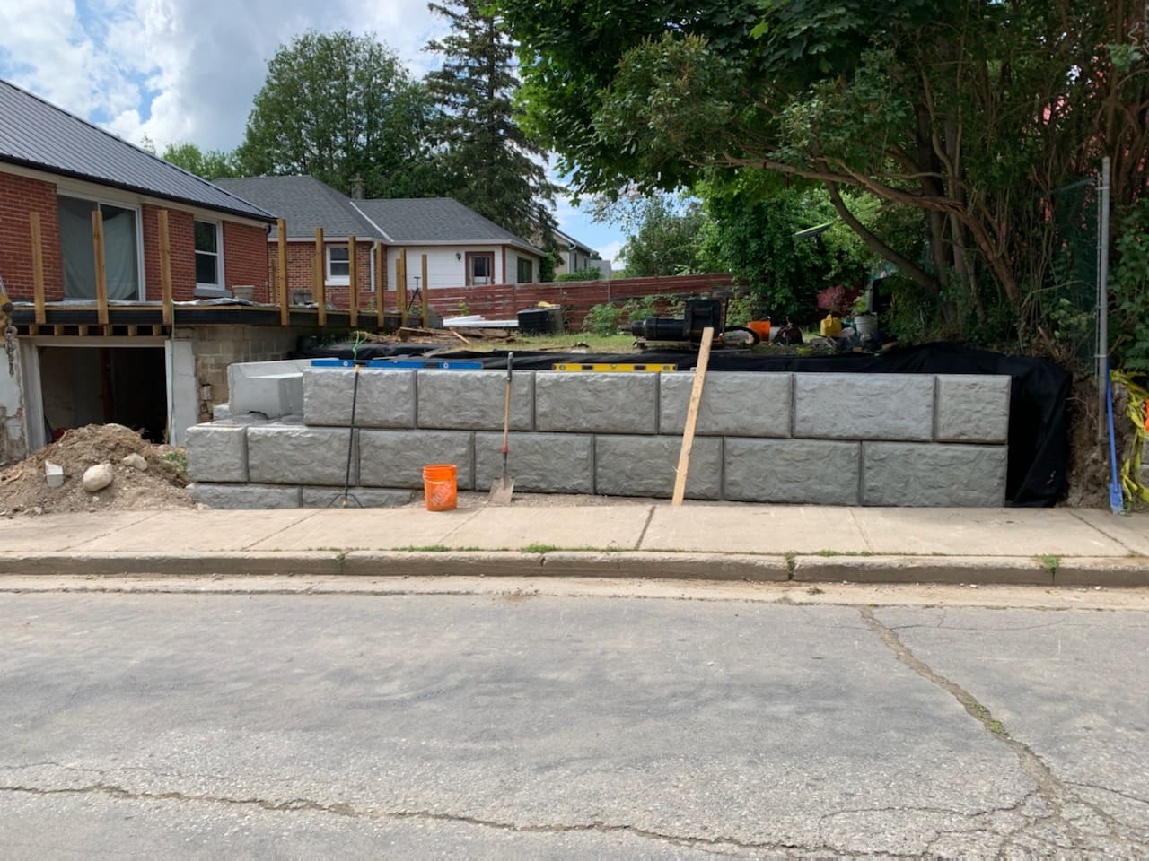 Concrete block retaining wall under construction