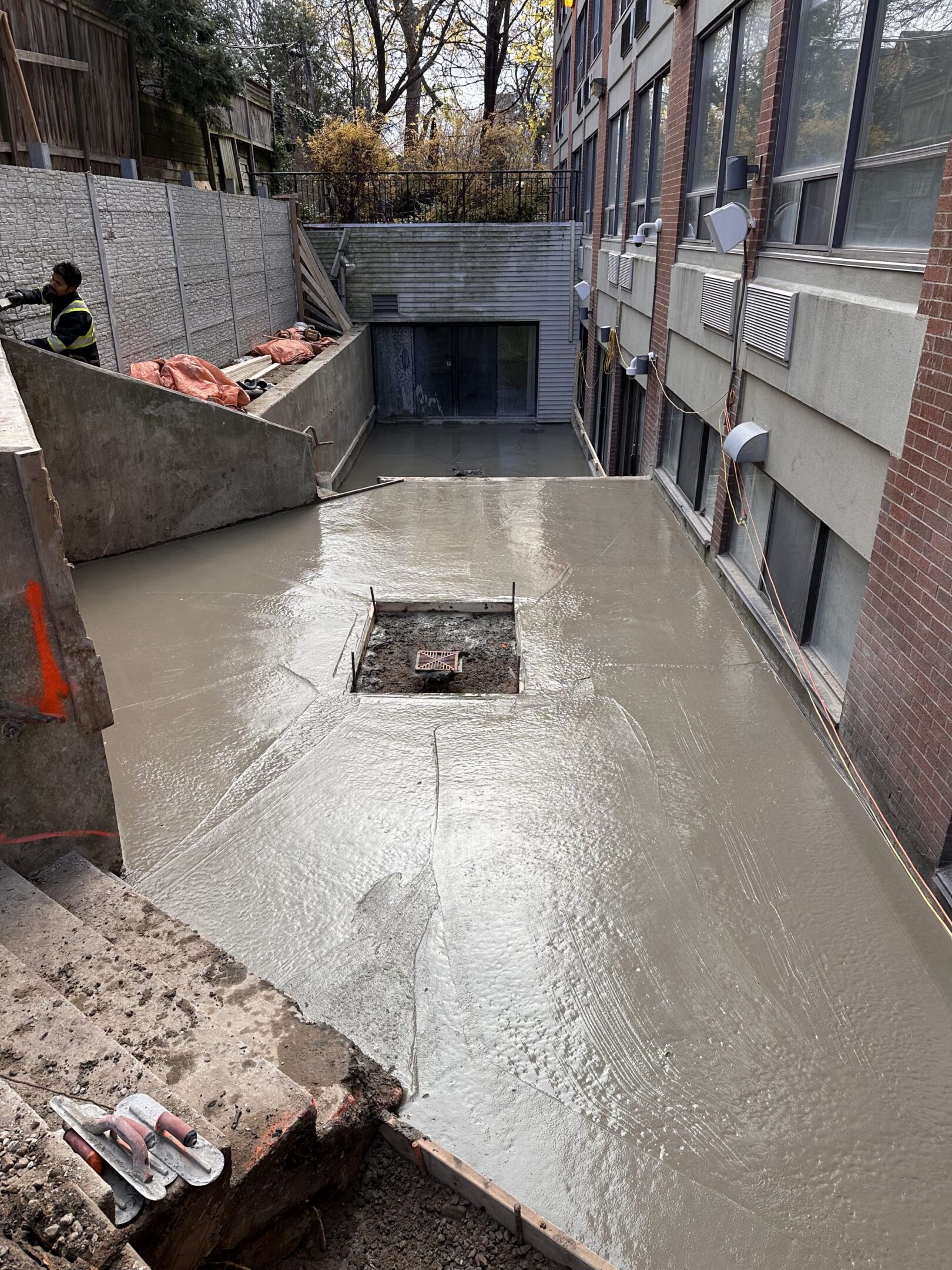 Freshly poured concrete courtyard with central hole
